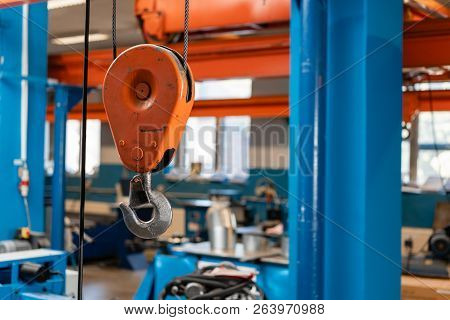 Crane Hook. The System Of Pulleys And Ropes, A Hanging Mechanism In The Production Area. Movement Re