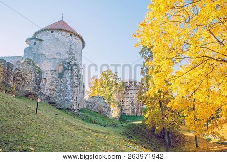 City Cesis, Latvia. Old Casttle Park At Autumn. Yellow Leafs, Ruins And Architecture. Historic Build