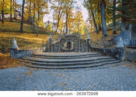 Old Casttle Park At Autumn. Yellow Leafs, Stairs And Architecture. Historic Buildings. Travel Photo