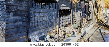 Damaged Industry Supermarket Metallic Facade After Arson Fire With Burnt Debris After Intense Burnin