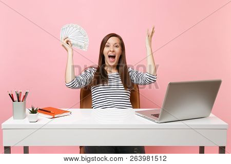 Surprised Happy Woman Spreading Hands Holding Bundle Lots Of Dollars, Cash Money Working At Office A