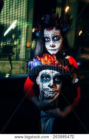 Zombie Couple In The Dark Outside, Blurry Lights, Ghosts. Day Of The Dead And Halloween.