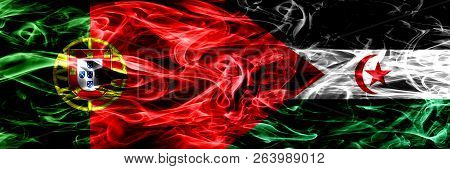 Portugal Vs Sahrawi Smoke Flags Placed Side By Side. Thick Colored Silky Smoke Flags Of Portuguese A