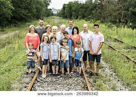 Large Family With Cousin Grandparent Father And Kid On A Forest