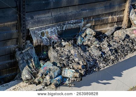 Close Up Damaged Industry Supermarket Metallic Facade After Arson Fire With Burn Debris Of Plastic B