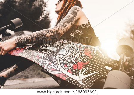 Ufa, Russia - September 12, 2018 Editorial Photo Of Young Girl With Tattoo And Dreadlocks Sitting In