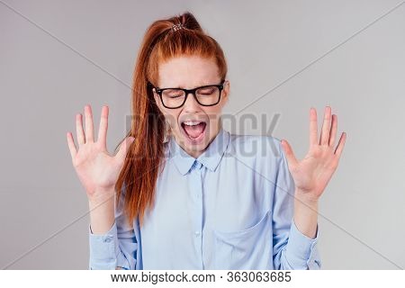 Redhair Ginger Woman Unsure Craving For Something Or Anxious, Isolated Grey Wall Background