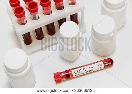 Coronavirus Positive Result Test And Laboratory Sample Of Blood