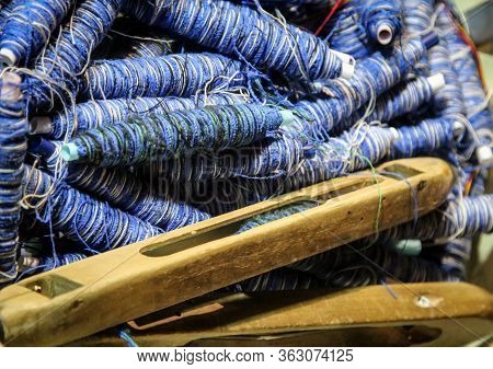A Loom With Accessories Threads, Wool, Boat.