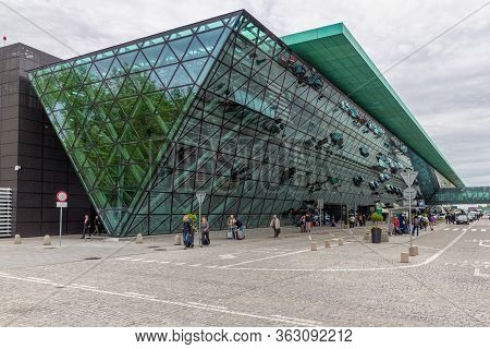 Krakow, Poland - May 13, 2019: Modern Airport Terminal Krakow With Green Glass Facade And Passengers