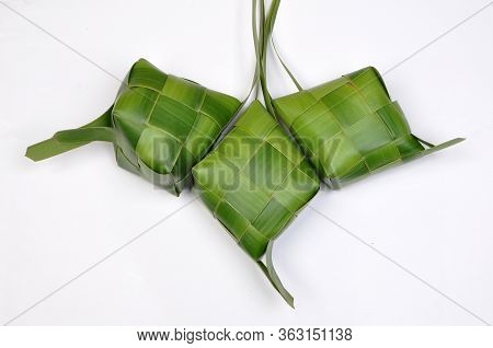 Ketupat, A Type Of Dumpling Made From Rice Packed Inside A Diamond-shaped Container Of Woven Palm Le