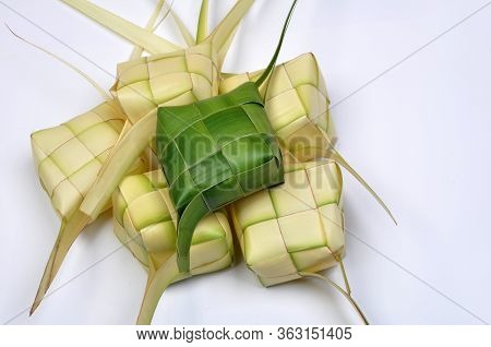Ketupat, A Type Of Dumpling Made From Rice Packed Inside A Diamond-shaped Container Of Woven Palm Le