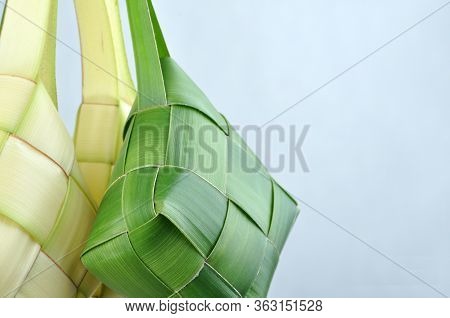 Ketupat, A Type Of Dumpling Made From Rice Packed Inside A Diamond-shaped Container Of Woven Palm Le