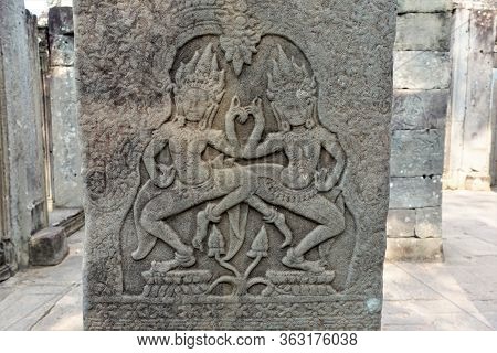 A Bas-relief Of Expressive Images Of Heavenly Dancers Is An Apsar In The Famous Angkor Temple Comple