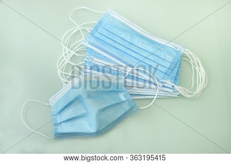 Blue Medical Doctor Face Masks Photo. Surgical Earloop Mask For Disease Prevention.