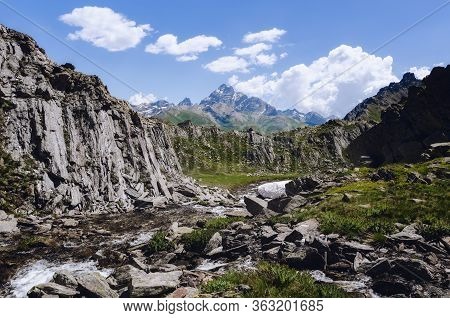 Mountain Path To The Blue Lake Of Chianale, In The Italian Alps Of Cuneo, Piedmont, With The Famous 