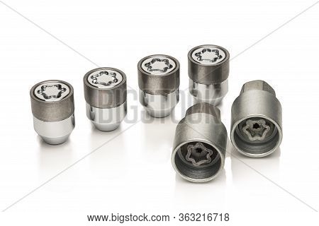 Car Lock Nuts, Wheel Nut That Protect The Wheels From Theft. Close-up Of The Isolate On A White Back