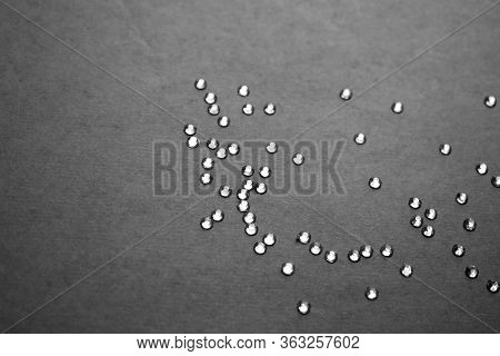 Shiny Diamonds On The Black Paper Background