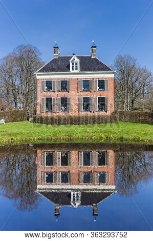 Historic Mansion Ennemaborg With Reflection In The Pond In Midwolda, Netherlands