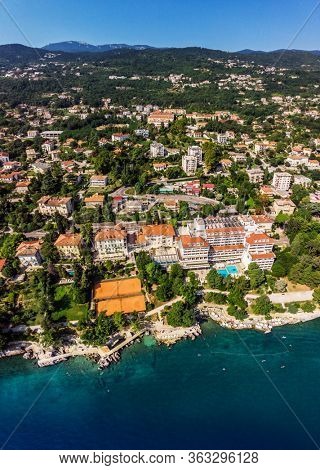 Beautiful panoramic view of Lovran village and its sea shore in Croatia. Top view photo taken on drone.