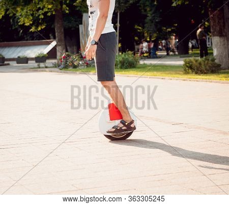 Young Man Driving On Solowheel In The Park.