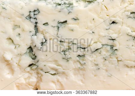 Texture Of The Blue Cheese With Blue-grey Mold On Cut Of Piece Close-up, Background