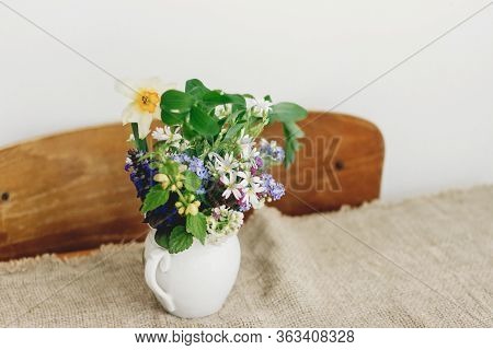 Spring Wildflowers In Vintage Cup On Rustic Wooden Table. Blooming Colorful Flowers Of Ajuga, Forget