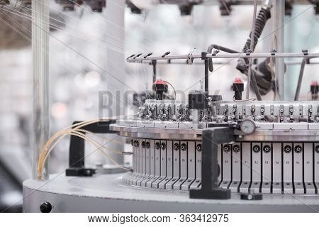 Textile Manufacturing. Circular Knitted Fabric. Textile Factory In Spinning Production Line And A Ro