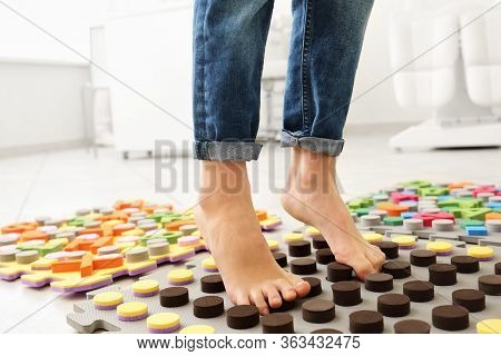 Child Flatfoot Treatment Using Special Massage Carpet.little Girl On Massage Mat Doing Exercises For
