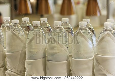 Bottled Drinking Water Wrapped With Napkin For Service