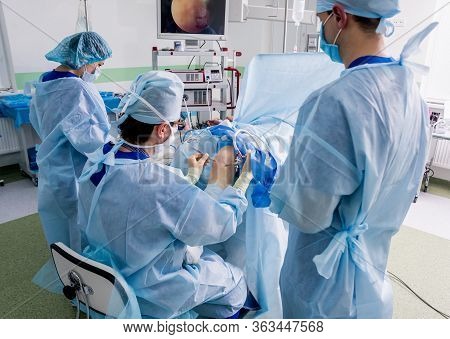 Arthroscope Surgery. Orthopedic Surgeons In Teamwork In The Operating Room