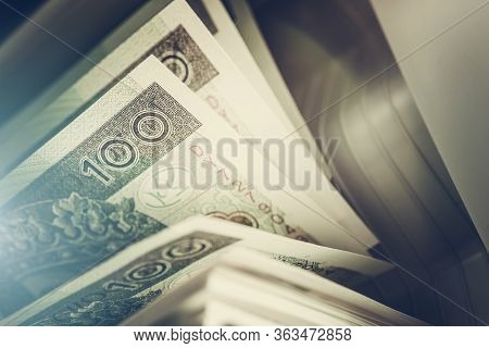 Business Concept With Polish Zloty Bills Counting By Banknotes Counter.