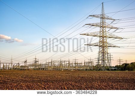 The Power Transmission Towers Of Sunset Sky Background . Electric Tower