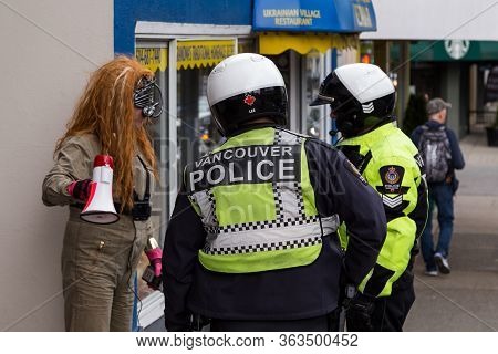 Downtown Vancouver, Bc, Canada - Apr 26, 2020: Antifa Member Being Detained By Police At A Anti Lock