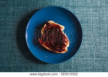 Plant-based Food, Biten Slice Of Bread With Raspberry Jam Topping