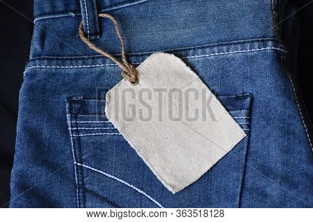 Plain Clothing Tag Mockup On Jeans Background