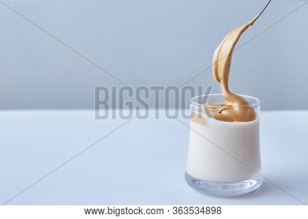 Korean Dalgon Coffee. Minimalism On A White Concrete Boom Background. Copy Space. Faceless.
