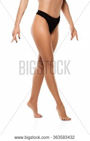 Beautiful Female Legs, Buttlocks And Belly Isolated On White Background. Beauty, Cosmetics, Spa, Dep