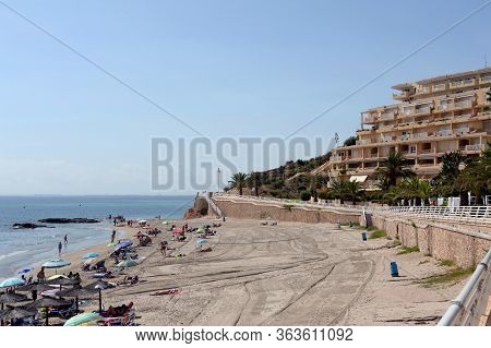 Orihuela, Costa Blanca, Spain - September 19, 2018:people Relax On The Sandy Beach Of Playa De Aguam