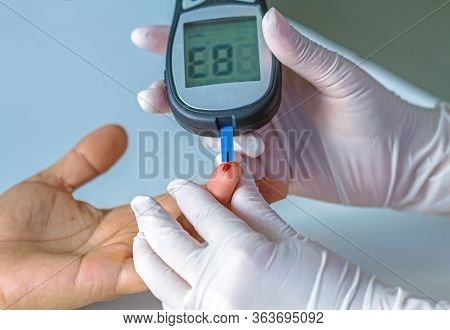 Blood Glucose Meter, The Blood Sugar Value Is Measured On A Finger