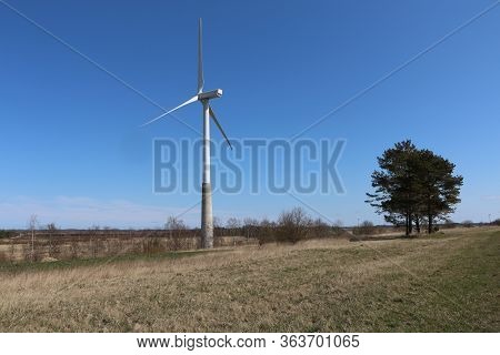 A Wind Generator Or Wind Turbine For A Wind Farm. Rotates To Generate Electricity Outdoors With The 