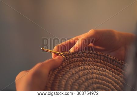 Round Raffia Crochet Panno In Female Hands. Handcraft, Hobby Concept: Making A Wall Hanging And A Cr