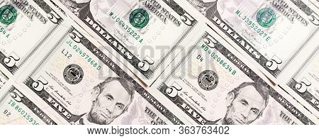 Close Up Of 5 Dollar Bills As A Background. Amarican Dollars Pattern. Top View Of Business Concept