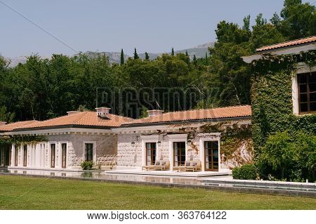 Budva, Montenegro - 10 June 2019: Luxury Hotel Aman Sveti Stefan. The Facade Of The Spa Building. Wh