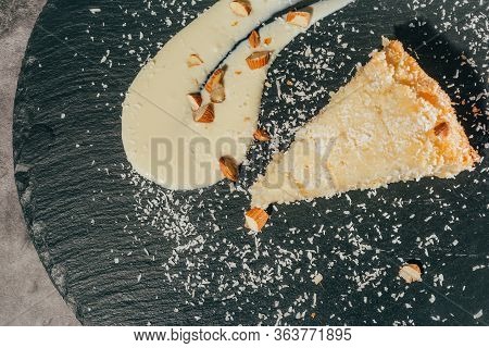 Cake With Almonds And Coconut Shvings On Top . Top View .