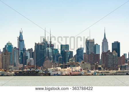NEW YORK, USA - APR 28, 2020: USNS Comfort park at Pier during Coronavirus pandemic outbreak and is scheduled to depart soon. 