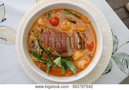 Kaeng Pled Ped Yang (roasted Duck In Red Curry With Tomato,pineapple,lychee Prepared In Coconut Milk