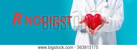 R Nought Theme With A Doctor Holding A Heart On A Blue Background
