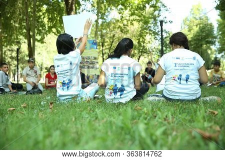 Outdoor Orienteering Check Point Activity . They Sit In The Pasture And Explain The Game Of Orientee