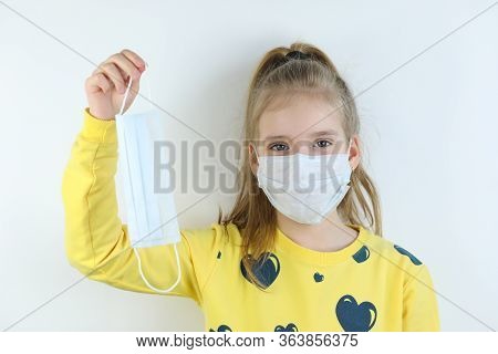 Glad And Happy Beautiful Joy,child In The Medical Helthcare Guarding Or Protecting Mask And In Yello
